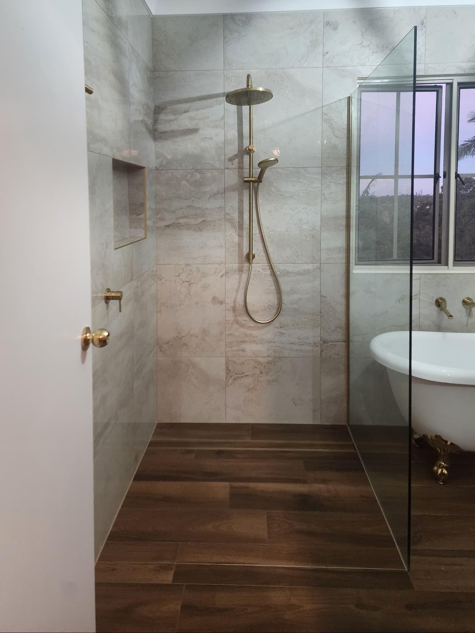 Walk-in shower with brushed gold rain head — Broadbeach, Gold Coast